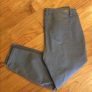 Miss poured in blue gray skinny jeans